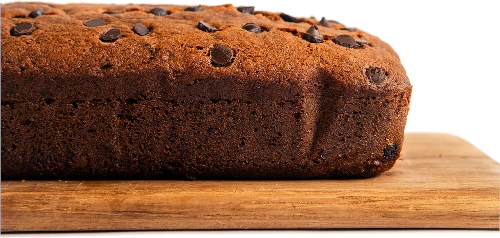 Mama's chocolate chip banana cake loaf on a wooden board
